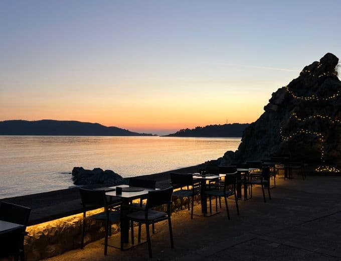 Patio tables at golden hour in Glyfada